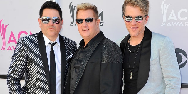 Recording artists Jay DeMarcus, Gary LeVox, and Joe Don Rooney of music group Rascal Flatts arrive at the 52nd Academy Of Country Music Awards on April 2, 2017 in Las Vegas, Nevada. (Photo by Allen Berezovsky/WireImage for Fashion Media )