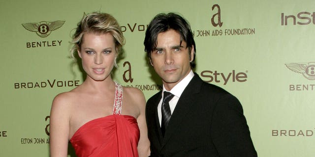 Rebecca Romijn-Stamos and John Stamos at the 12th Annual Elton John AIDS Foundation Academy Awards Party in West Hollywood.