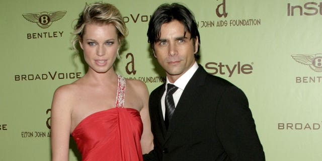 Rebecca Romijn-Stamos and John Stamos during the Elton John AIDS Foundation's 12th Annual Oscar party in West Hollywood.