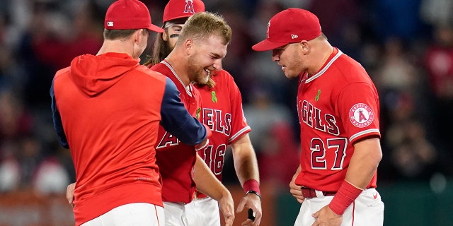 Los Angeles Angels starting pitcher Reid Detmers celebrates with teammates after throwing a no-hitter against the Tampa Bay Rays in Anaheim, California, Tuesday, May 10, 2022.