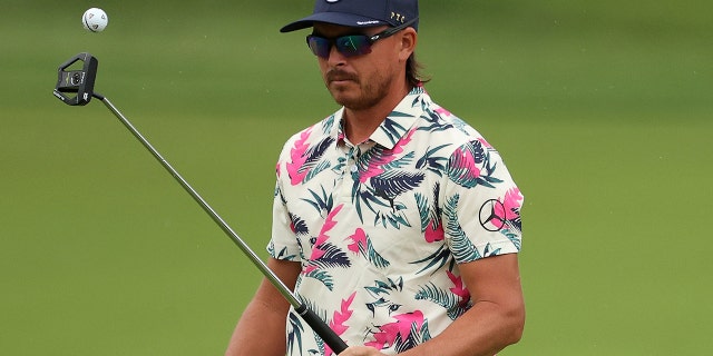 Rickie Fowler prepares to putt during a practice round before the 2022 PGA Championship at Southern Hills Country Club on May 17, 2022, in Tulsa, Oklahoma.