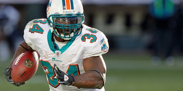 Miami Dolphins running back Ricky Williams # 34 during the NFL regular season match between the Miami Dolphins and the Oakland Raiders at the Oakland Coliseum in Oakland, California.