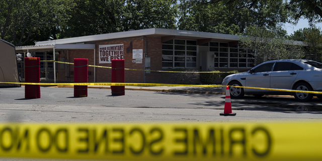 Crime scene tape surrounds Robb Elementary School in Uvalde, Texas, on Wednesday, May 25.