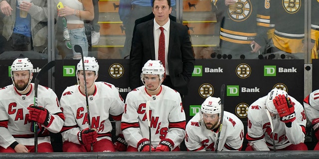 Carolina Hurricanes head coach Rod Brind'Amour and team members watch as they follow the Bruins into the first-round playoff series on Sunday, May 8, 2022 in Boston.