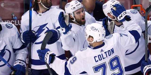Tampa Bay Lightning center Ross Colton (79) is congratulated after scoring agains the Florida Panthers in the closing seconds of Game 2 of an NHL hockey second-round playoff series Thursday, May 19, 2022, in Sunrise, Fla.