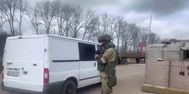 A vehicle passes through a checkpoint near Kharkiv, Ukraine.