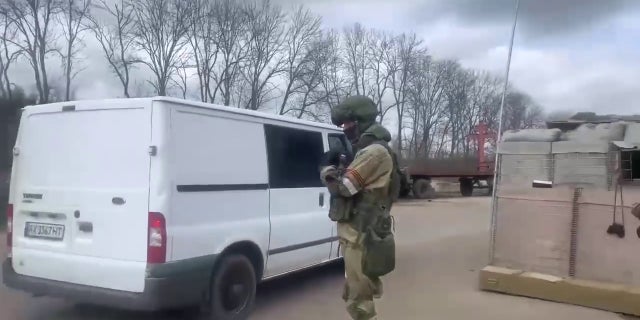 A vehicle passes through a checkpoint near Kharkiv, Ukraine.