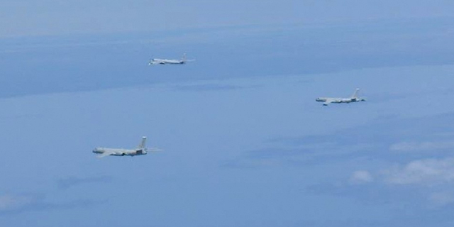 A Russian TU-95 bomber and Chinese H-6 bombers fly over East China Sea on Tuesday, May 24.