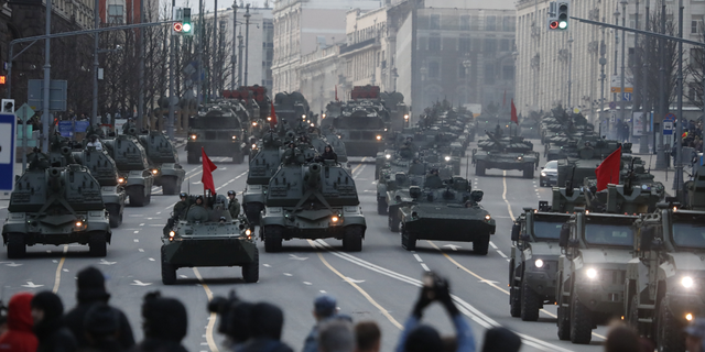 Russian self-propelled artillery vehicles, tanks and military vehicles roll along Tverskaya street toward Red Square during a rehearsal for the Victory Day military parade in Moscow. The Kremlin plans to expand its armed forces to 1.5 million troops by 2026, officials said Tuesday. 