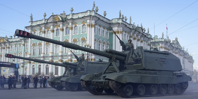 Self-propelled artillery vehicles Msta-S drive past the Winter Palace during a rehearsal for the Victory Day military parade in St. Petersburg, Russia, on Thursday, April 28.