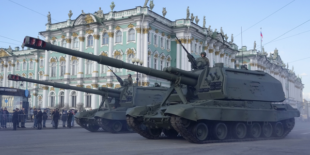 Self-propelled artillery vehicles Msta-S drive past the Winter Palace during a rehearsal for the Victory Day military parade in St. Petersburg, Russia, on Thursday, April 28.