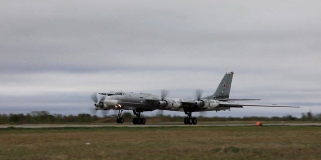A Russian Tu-95 strategic bomber takes off during Russian-Chinese military aerial exercises to patrol the Asia-Pacific region, at an unidentified location, in this still image taken from a video released on Tuesday, May 24. 