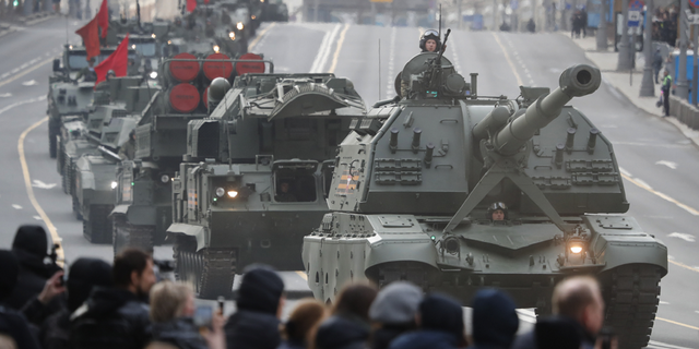 A Russian self-propelled artillery vehicle and military vehicles roll along Tverskaya street toward Red Square during a rehearsal for the Victory Day military parade in Moscow, Russia, on Thursday, April 28.