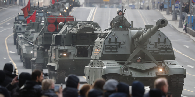 A Russian self-propelled artillery vehicle and military vehicles roll along Tverskaya street toward Red Square during a rehearsal for the Victory Day military parade in Moscow, Russia, on Thursday, April 28.
