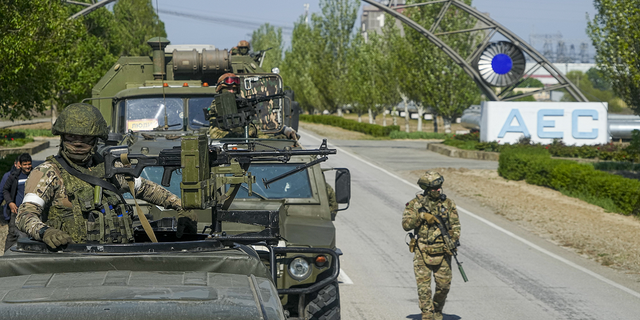 A Russian military convoy stands on the road toward the Zaporizhzhia Nuclear Power Station in southeastern Ukraine on Sunday, May 1.
