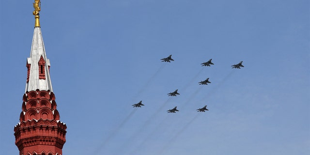 Russian MiG-29SMT jet fighters forming the symbol "Z" in support of the Russian armed forces fly in formation during a rehearsal for a flypast, part of a military parade marking the anniversary of the victory over Nazi Germany in World War II, in central Moscow, Russia May 7, 2022. 