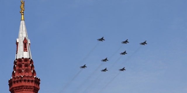 Russian jet fighters MiG-29SMT forming the symbol "Z" in support of the Russian armed forces fly in formation during a rehearsal for a flypast, part of a military parade marking the anniversary of the victory over Nazi Germany in World War II in central Moscow, Russia, May 7, 2022.