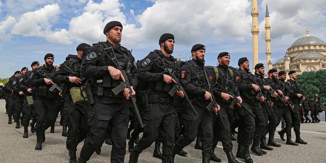 Service members take part in a military parade on Victory Day, which marks the 77th anniversary of the victory over Nazi Germany in World War II, in the Chechen capital Grozny, Russia May 9, 2022. 