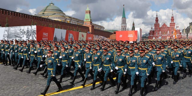 Russian service members march during a parade on Victory Day, which marks the 77th anniversary of the victory over Nazi Germany in World War II, in Red Square in central Moscow, May 9, 2022.