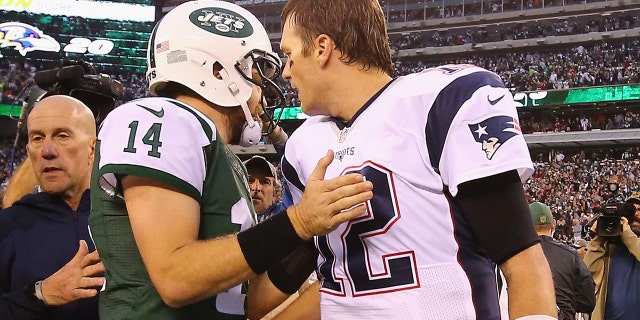 New York's Ryan Fitzpatrick meets Tom Brady of the New England Patriots after the Jets' 26-20 overtime win at MetLife Stadium on Dec. 27, 2015, in East Rutherford, New Jersey.