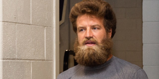 Ryan Fitzpatrick of the Washington Football Team heads for warm-ups before the New England Patriots game at Gillette Stadium on Aug. 12, 2021, in Foxborough, Massachusetts.