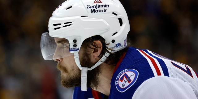 Ryan Lindgren of the New York Rangers lines up for a face-off in the Stanley Cup Playoffs against the Penguins on May 13, 2022, in Pittsburgh, Pennsylvania.