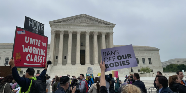 Protesters gather outside the Supreme Court to protest abortion rights.