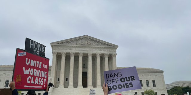 Protesters gather outside the Supreme Court to protest abortion rights.