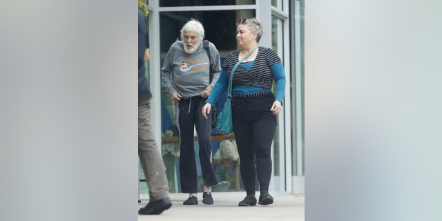 Dick Van Dyke, 96, is all smiles wearing a "Cucharada de Azúcar" sweater as he enjoys an outing in Malibu with his wife Arlene Silver.