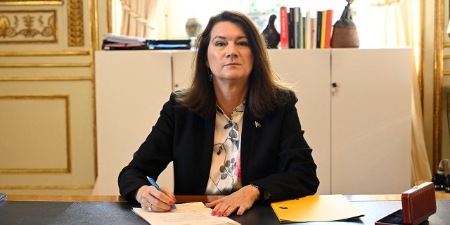 Sweden's Minister of Foreígn Affairs Ann Linde signs Sweden's application for NATO membership in Stockholm, Sweden, on May 17, 2022.