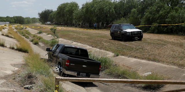 A police vehicle is seen parked near of a truck believed to belong to the suspect of a shooting at Robb Elementary School in Uvalde, Texas, on Tuesday, May 24.