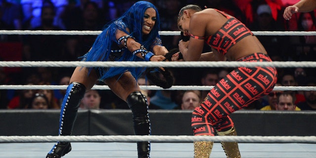 Sasha Banks pulls Bianca Belair's hair during the women's five-on-five elimination match during the WWE Survivor Series at the Barclays Center in Brooklyn on November 21, 2021.