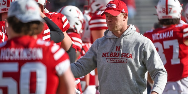 Head coach Scott Frost of the Nebraska Cornhuskers with the team before the game at Memorial Stadium against the Iowa Hawkeyes on November 26, 2021 in Lincoln, Nebraska.