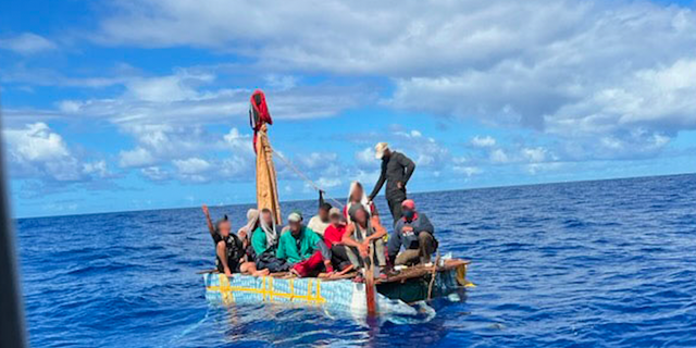 A group of Haitians attempt to make it to Florida on a makeshift boat. 