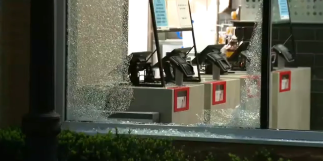 Windows shattered ar a McDonald's following a mass shooting in downtown Chicago on May 19, 2022.