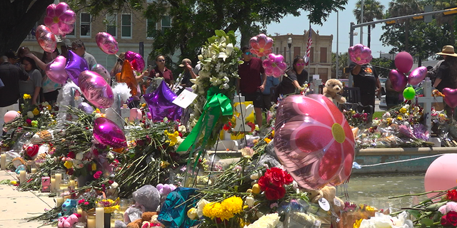 The makeshift memorials have quadrupled in size since Tuesday. 