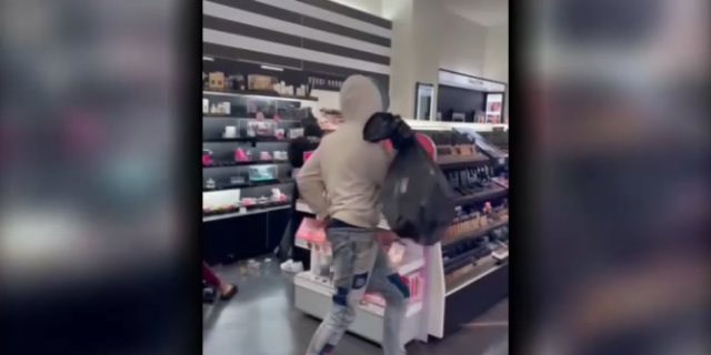 Shoplifters steal from a Sephora store in Los Angeles. 