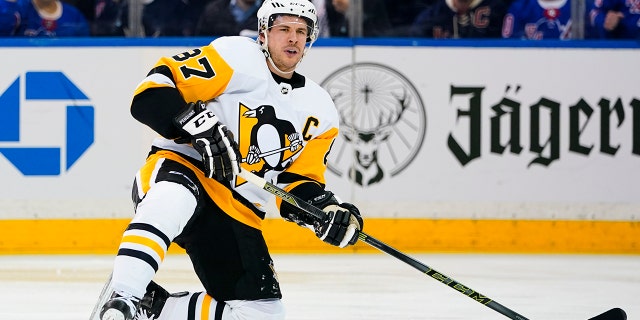 Pittsburgh Penguins' Sidney Crosby (87) reacts after getting knocked down during the first period of Game 5 of an NHL hockey Stanley Cup first-round playoff series against the New York Rangers Wednesday, May 11, 2022, in New York.