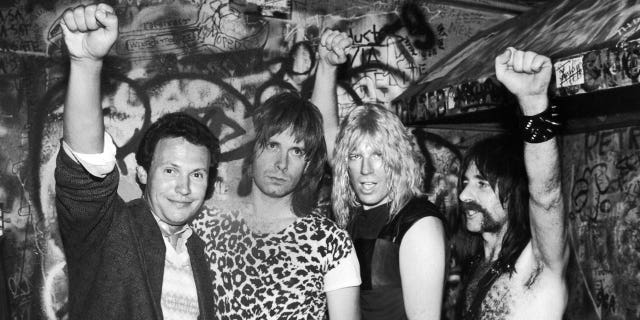 Comic actor Billy Crystal with costumed cast members of the film "This Is Spinal Tap."