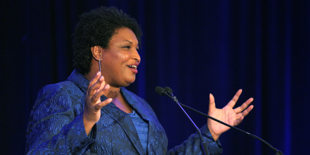Stacey Abrams addresses the Gwinnett County Democratic Party fundraiser on Saturday, May 21, 2022, in Norcross, Ga.