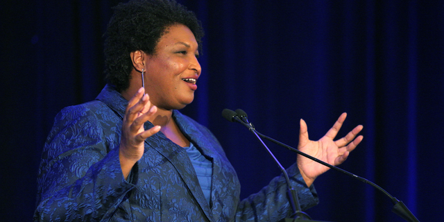 Stacey Abrams addresses the Gwinnett County Democratic Party fundraiser on Saturday, May 21, 2022, in Norcross, Ga.