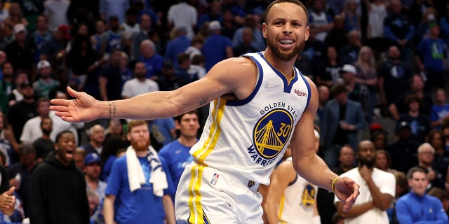 Stephen Curry #30 of the Golden State Warriors reacts after a no call foul against Luka Doncic #77 of the Dallas Mavericks during the fourth quarter in Game Three of the 2022 NBA Playoffs Western Conference Finals at American Airlines Center on May 22, 2022 in Dallas, Texas.
