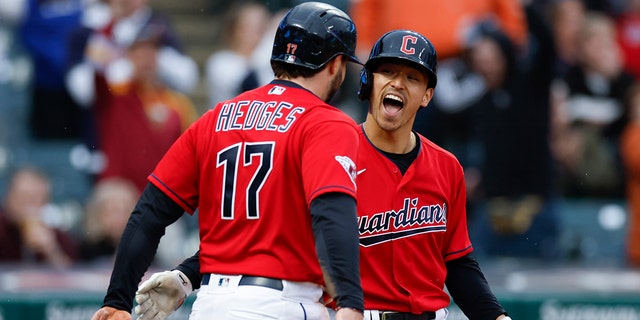 Cleveland Guardians' Steven Kwan celebrates with Austin Hedges (17) after hitting a two-run home run against the Toronto Blue Jays during the third inning of a baseball game Thursday, May 5, 2022, in Cleveland. 