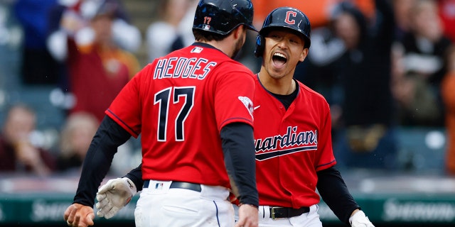 Cleveland Guardians' Steven Kwan celebrates with Austin Hedges (17) after hitting a two-run home run against the Toronto Blue Jays during the third inning of a baseball game Thursday, May 5, 2022, in Cleveland.