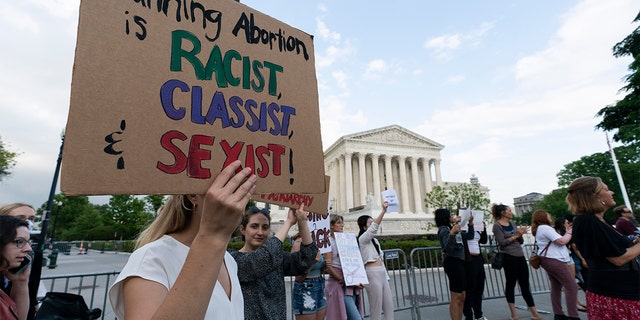 Demonstrators protest outside the U.S. Supreme Court May 4, 2022, a Washington. 