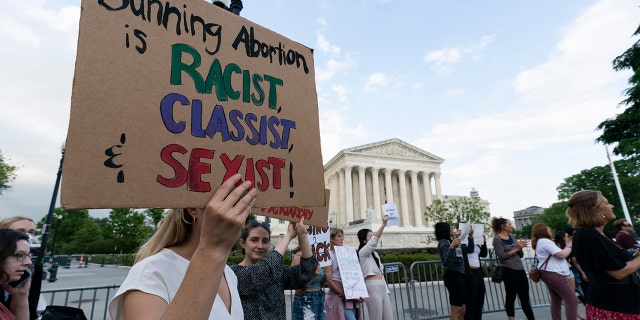 Demonstrators protest outside of the U.S. Supreme Court Wednesday, May 4, 2022 in Washington. (AP Photo/Alex Brandon)