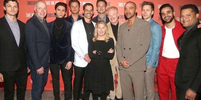 Second Stage artistic director Carole Rothman poses with the cast of "Take Me Out" at the opening night party at The Yard House on April 4, 2022, in New York City.