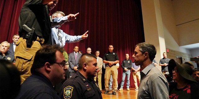 Texas Democratic gubernatorial candidate Beto O'Rourke disrupts a press conference held by Governor Greg Abbott the day after a gunman killed 19 children and two teachers at Robb Elementary school in Uvalde, Texas, May 25, 2022. 