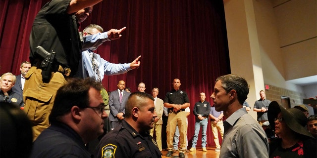 Texas Democratic gubernatorial candidate Beto O'Rourke disrupts a press conference held by Governor Greg Abbott the day after a gunman killed 19 children and two teachers at Robb Elementary school in Uvalde, Texas, May 25, 2022.