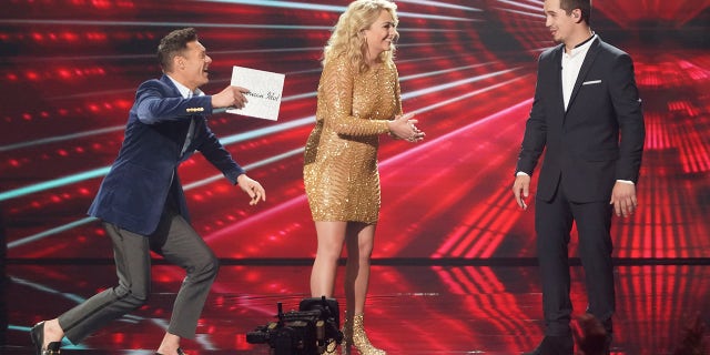 Host Ryan Seacrest and contestant HunterGirl react to Noah Thompson winning "American Idol" season 20.